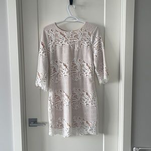 White dress with nude underlay.